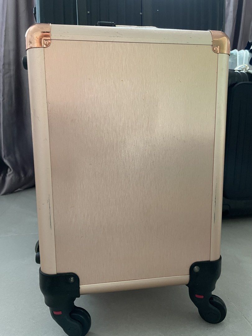 MAKEUP CASE (Category: Art & Prints) located in Singapore. Submitted by orchidlatte (Listing ID 1458936092, Image 2). Description: - Stylish rose gold makeup case - Features smooth-rolling wheels for easy portability - Reinforced corners for durability - Ideal for organizing makeup and beauty products - Elegant and practical design.