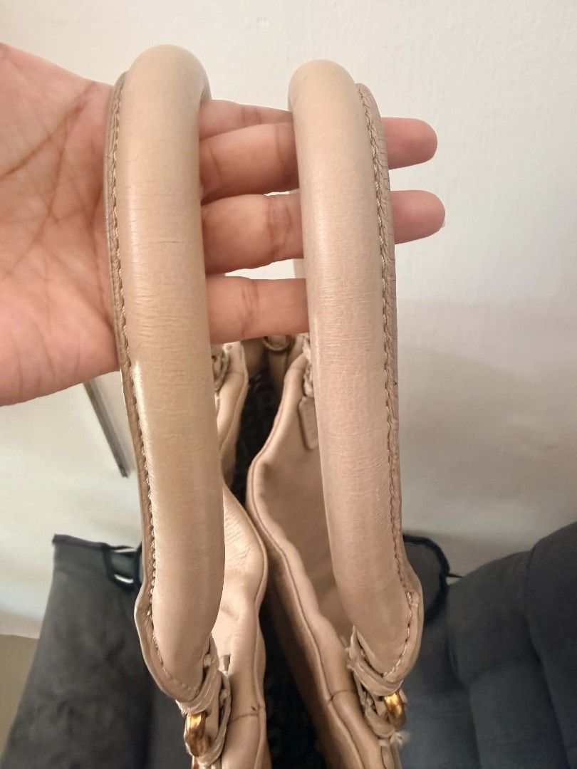 Marc by Marc Jacobs Standard Supply Leather Handbag (Category: Luxury Bags & Wallets) located in Pinamalayan. Submitted by chay0921 (Listing ID 1458969003, Image 3). Description: - Brand: Marc by Marc Jacobs - Style: Standard Supply Handbag - Material: Soft Leather - Color: Tan/Beige - Condition: Good overall, with visible wear on handles (as pictured) - Features: Spacious interior, classic design - Perfect for: Everyday use.