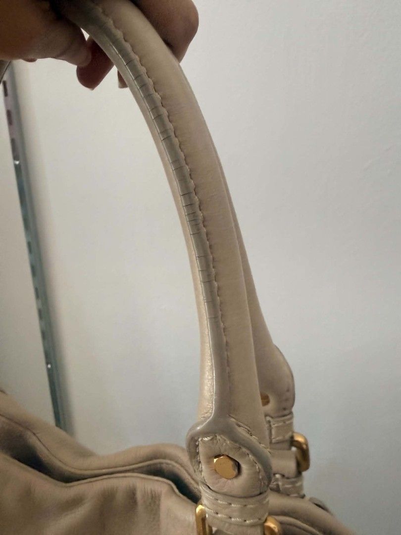 Marc by Marc Jacobs Standard Supply Leather Handbag (Category: Luxury Bags & Wallets) located in Pinamalayan. Submitted by chay0921 (Listing ID 1458969003, Image 2). Description: - Brand: Marc by Marc Jacobs - Style: Standard Supply Handbag - Material: Soft Leather - Color: Tan/Beige - Condition: Good overall, with visible wear on handles (as pictured) - Features: Spacious interior, classic design - Perfect for: Everyday use.