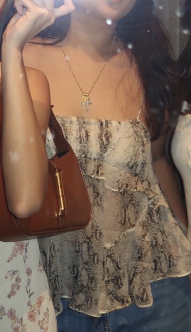 Massimo Dutti Sheer Snake Print Ruffle Camisole Top (Category: Sleeveless) located in Meycauayan. Submitted by m4teri4lgirl (Listing ID 1457612415, Image 3). Description: WORN ONCE OG PRICE ₱4490 -Cute sheer camisole top - Trendy snake print - Ruffle details on front and sides - Adjustable spaghetti straps - Versatile: pairs well with shorts or jeans - Perfect for night outs or casual days.