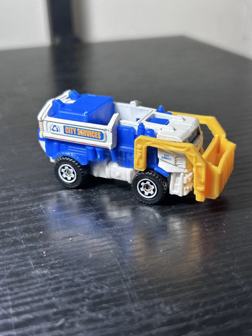Matchbox City Services Garbage Truck Toy (Category: Vehicle & Diecast Models) located in San Marcelino. Submitted by sainthustle (Listing ID 1459059449, Image 1). Description: - Matchbox garbage truck - Blue and white with yellow front loader - Marked 'City Services' - Made in Thailand - Ideal for imaginative play.