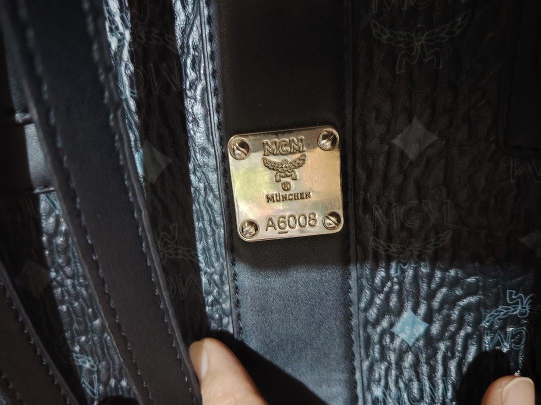 MCM München Tote Bag (Category: Luxury Bags & Wallets) located in Santa Rosa. Submitted by RRRR0520 (Listing ID 1458906375, Image 3). Description: - Classic MCM tote bag - All-over iconic MCM monogram print - Genuine leather trim and handles - Interior features checkered lining - Signature metal MCM logo plate on the front - Convenient drawstring closure on the sides WHAT U C S WHAT U GET - Ideal for everyday use PLS CHECK PHOTOS Paki self authen
