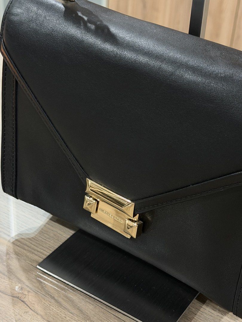 Michael Kors Black Leather Chain Shoulder Bag (Category: Luxury Bags & Wallets) located in Manila. Submitted by macy_clee (Listing ID 1458971506, Image 2). Description: - Like New - Gold chain strap - Clean and spacious interior - Versatile for day or night use.