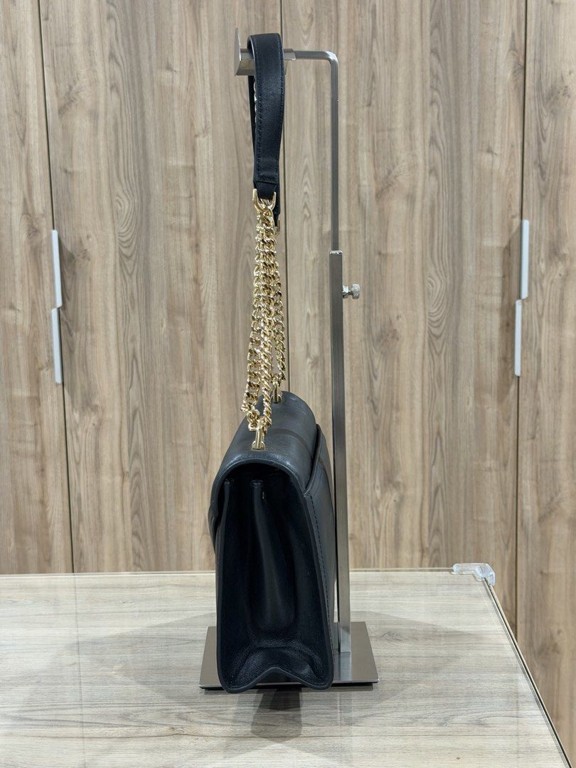 Michael Kors Black Leather Chain Shoulder Bag (Category: Luxury Bags & Wallets) located in Manila. Submitted by macy_clee (Listing ID 1458971506, Image 3). Description: - Like New - Gold chain strap - Clean and spacious interior - Versatile for day or night use.