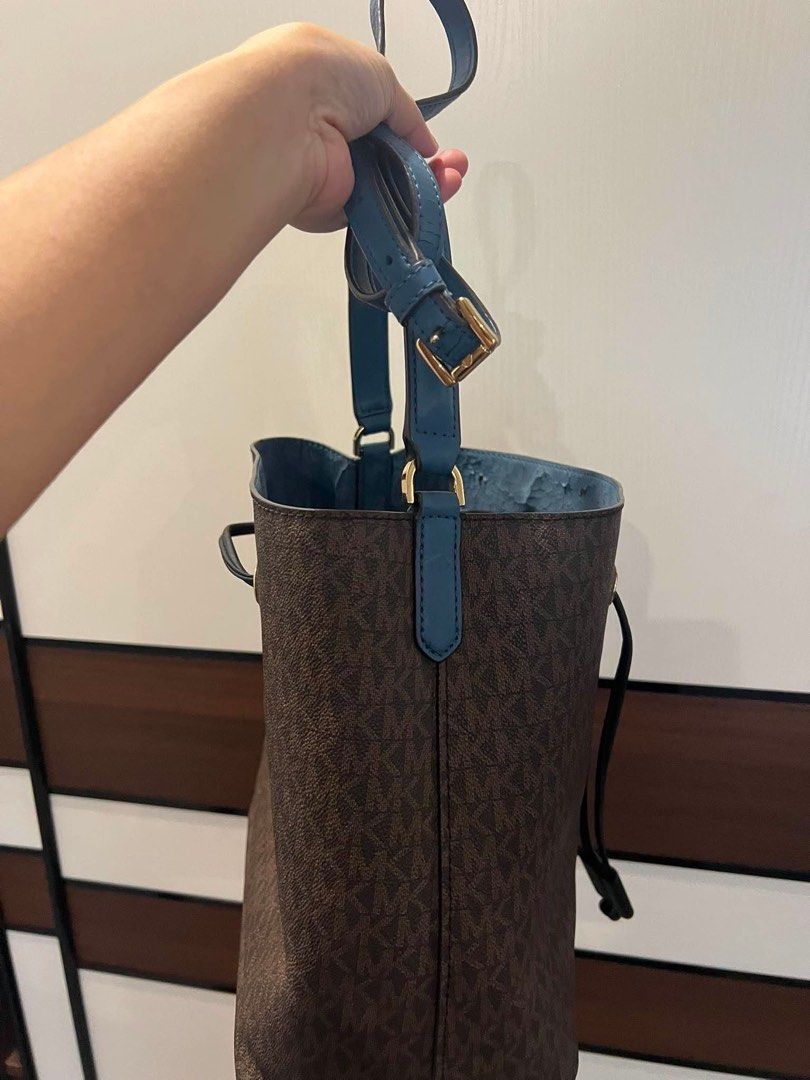 Michael Kors Monogram Bucket Bag (Category: Luxury Bags & Wallets) located in Quezon City. Submitted by anna_rl23 (Listing ID 1459088237, Image 3). Description: - Authentic Michael Kors bucket bag - Signature monogram print in brown - Contrasting blue interior - Secure drawstring closure - Adjustable strap for comfortable wear - Gold hardware details - Please note: some wear on interior lining, as pictured - Includes original dust bag.