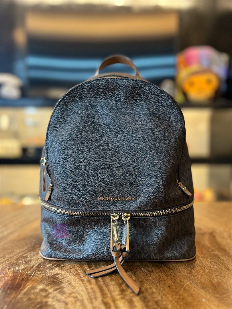 Michael Kors Rhea Medium Backpack (Category: Backpacks) located in Las Pinas. Submitted by jhind_ (Listing ID 1458950722, Image 1). Description: Used in good condition Bought in Japan See photos for detailed condition. Thank you..