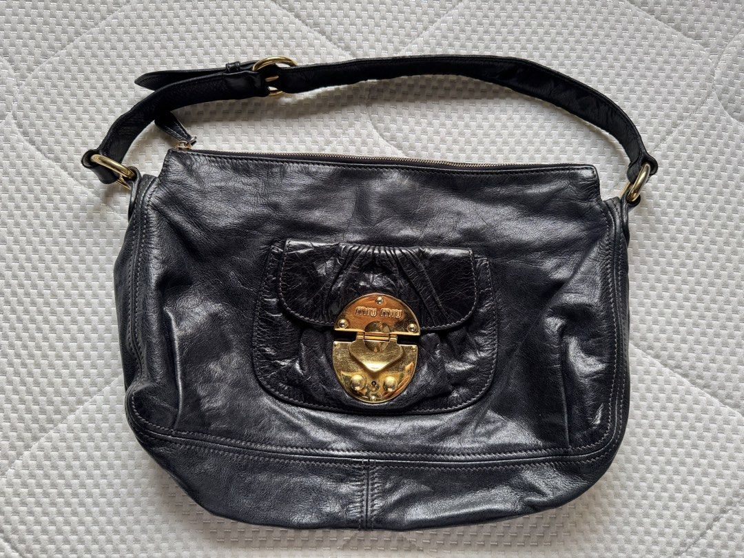Miu Miu Hobo Black Leather Bag (Category: Luxury Bags & Wallets) located in Manila. Submitted by thevintage90_sretro. (Listing ID 1459004556, Image 1). Description: Miu Miu Hobo Black Leather Bag Legit dm.