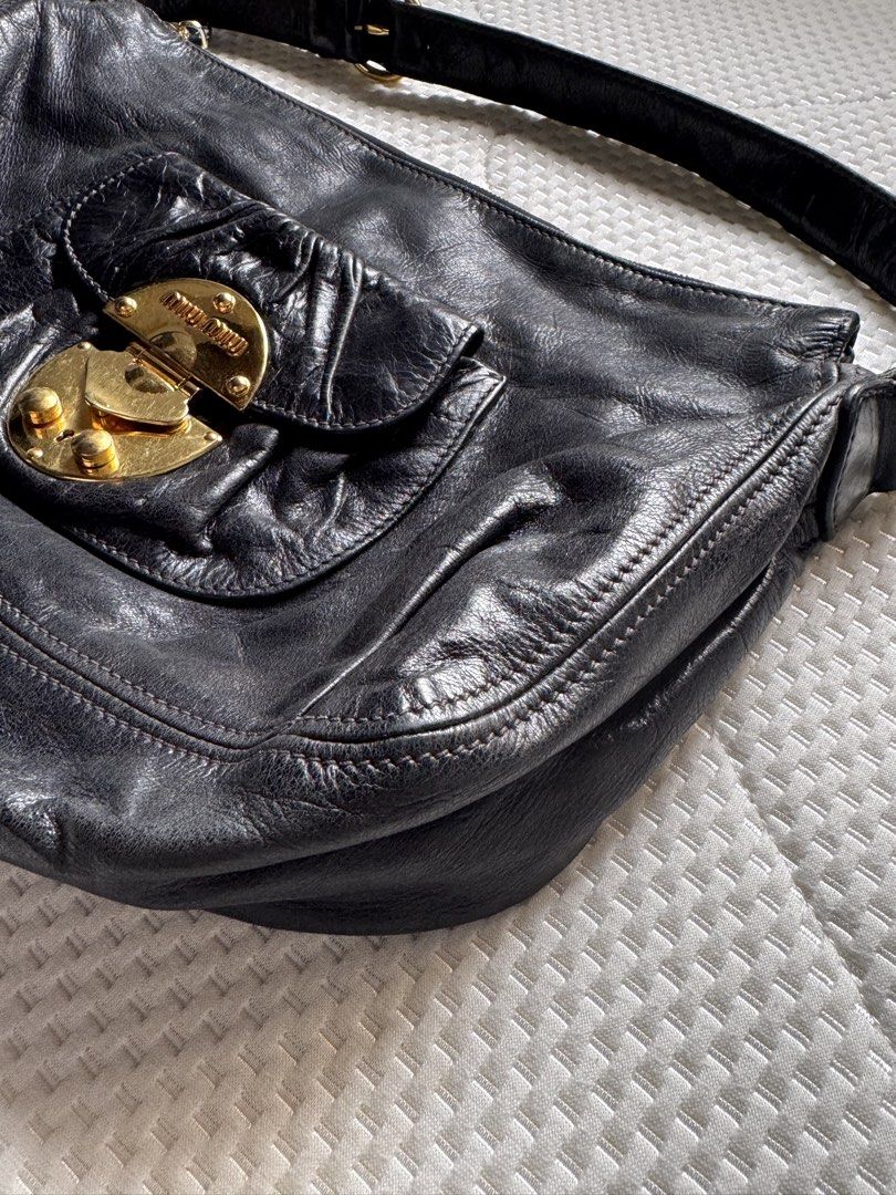 Miu Miu Hobo Black Leather Bag (Category: Luxury Bags & Wallets) located in Manila. Submitted by thevintage90_sretro. (Listing ID 1459004556, Image 3). Description: Miu Miu Hobo Black Leather Bag Legit dm.