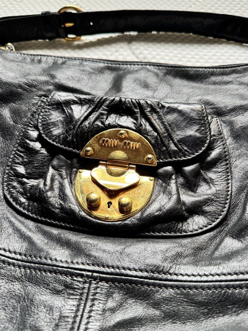 Miu Miu Hobo Black Leather Bag (Category: Luxury Bags & Wallets) located in Manila. Submitted by thevintage90_sretro. (Listing ID 1459004556, Image 2). Description: Miu Miu Hobo Black Leather Bag Legit dm.