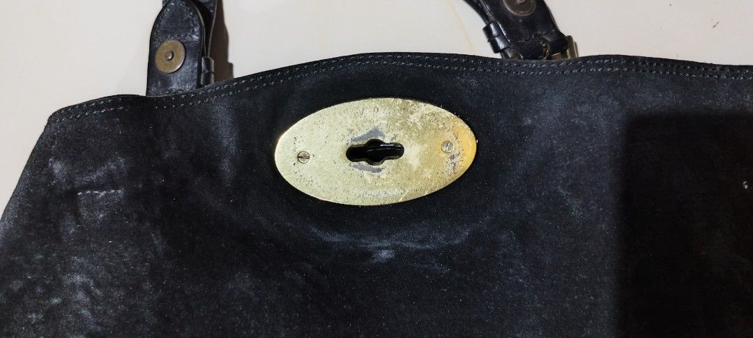 Mulberry Black Leather Backpack with Gold Hardware (Category: Backpacks) located in Paranaque City. Submitted by poego (Listing ID 1458949593, Image 2). Description: - Genuine Mulberry black leather backpack - Signature Postman's Lock closure - Adjustable straps for comfort - Interior zip pocket for essentials - Lined with classic Mulberry tree logo - Minor signs of wear on hardware and leather, adding character - Spacious interior, perfect for d