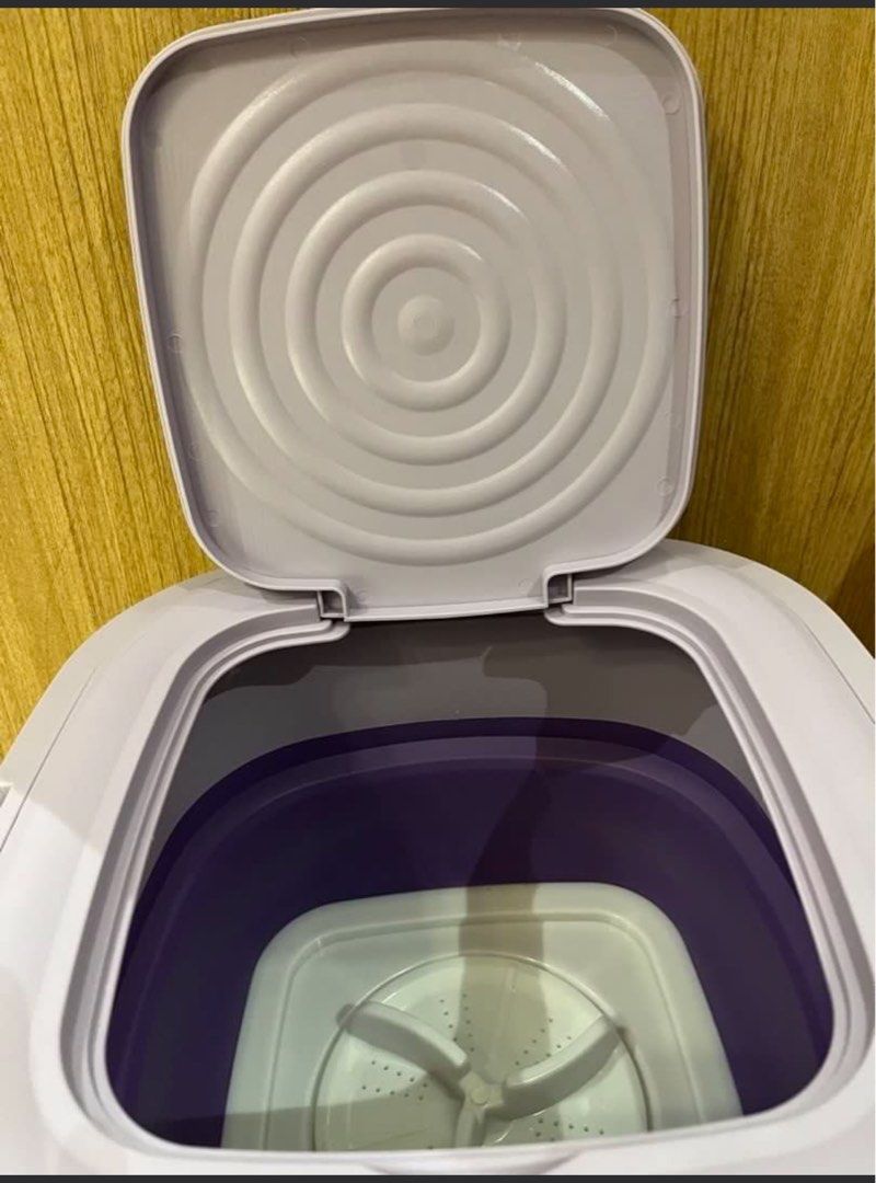 Multi-Function Foldable Washing Machine (Category: Washing Machines and Dryers) located in Singapore. Submitted by prestige-corner (Listing ID 1458919428, Image 1). Description: - Portable folding washing machine - Perfect for small loads or delicate items - Easy to set up and store - Comes with a spin dryer basket - Ideal for travel or small living spaces - Compact and convenient.