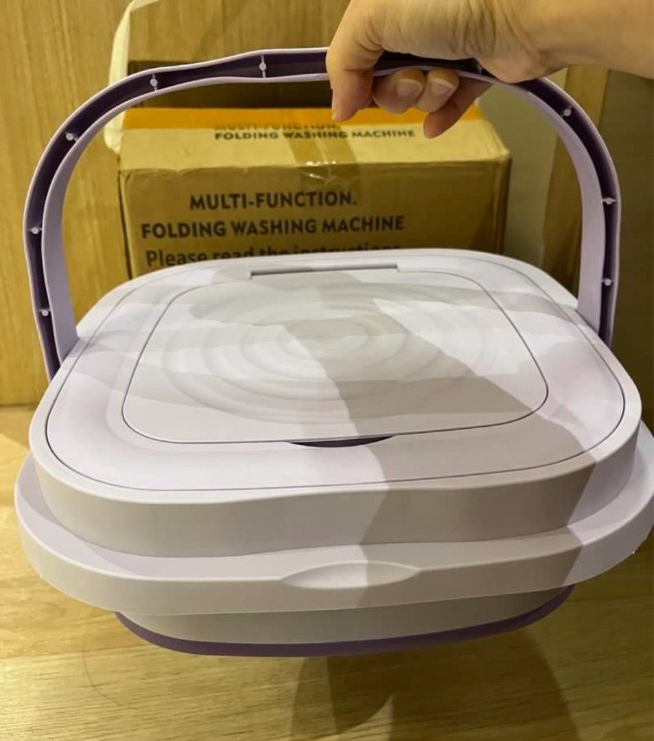 Multi-Function Foldable Washing Machine (Category: Washing Machines and Dryers) located in Singapore. Submitted by prestige-corner (Listing ID 1458919428, Image 3). Description: - Portable folding washing machine - Perfect for small loads or delicate items - Easy to set up and store - Comes with a spin dryer basket - Ideal for travel or small living spaces - Compact and convenient.