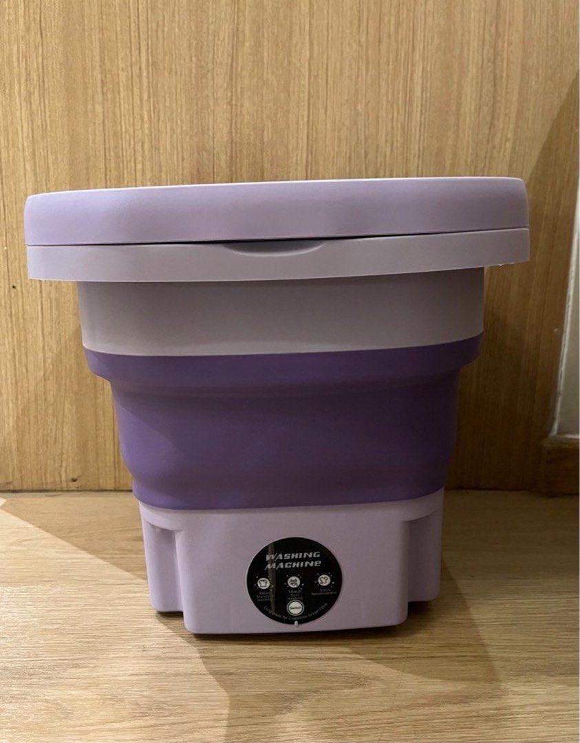 Multi-Function Foldable Washing Machine (Category: Washing Machines and Dryers) located in Singapore. Submitted by prestige-corner (Listing ID 1458919428, Image 4). Description: - Portable folding washing machine - Perfect for small loads or delicate items - Easy to set up and store - Comes with a spin dryer basket - Ideal for travel or small living spaces - Compact and convenient.