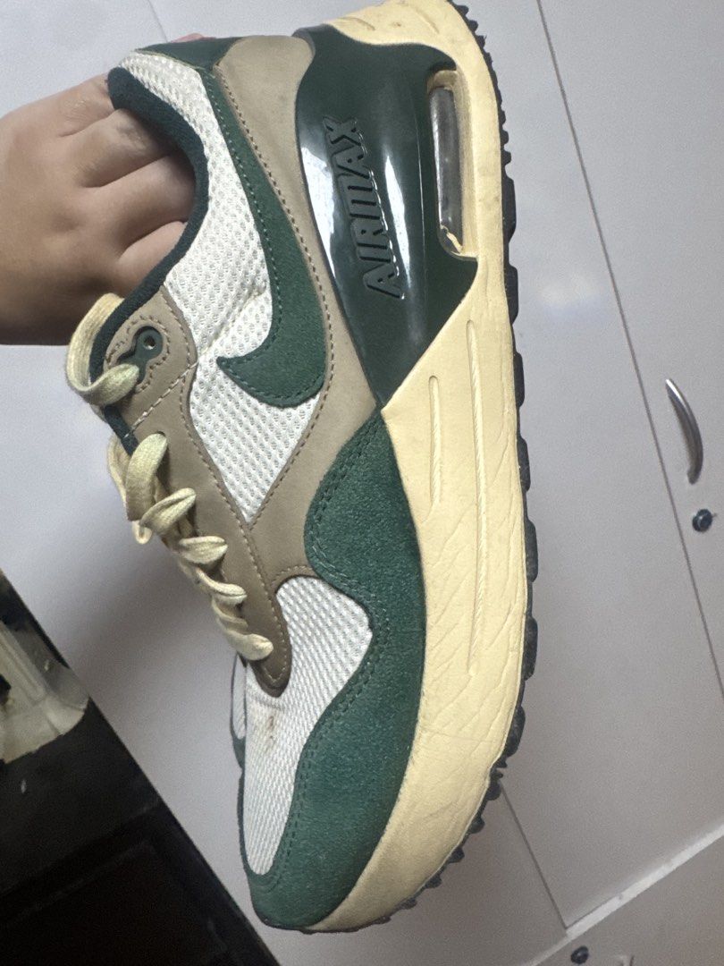 Nike Air Max SYSTM Green (Category: Sneakers) located in Manila. Submitted by quintessesommerset (Listing ID 1458968417, Image 3). Description: - Classic Nike Air Max 1 sneakers, minor stain just recently obtained, can easily be removed - Colorway: Green, brown, and white panels - Materials: Mesh and suede construction - Laces: Light cream color - Perfect for casual everyday wear - Condition: Minor marks on sole and upper, consistent with normal 