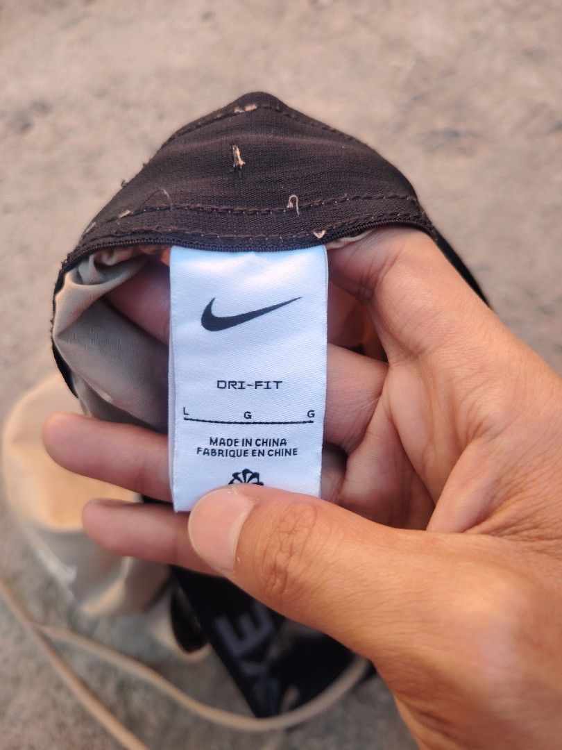 Nike Dri-Fit Shorts Size L Beige (Category: Shorts) located in Calapan. Submitted by thriftopia_12 (Listing ID 1458958010, Image 3). Description: - Beige Nike Dri-Fit Shorts - Size: Large (L) - Elastic waistband with drawstring for a comfortable fit - Convenient pockets - Features a large Nike swoosh logo on one leg and a smaller logo on the other - Made in China.