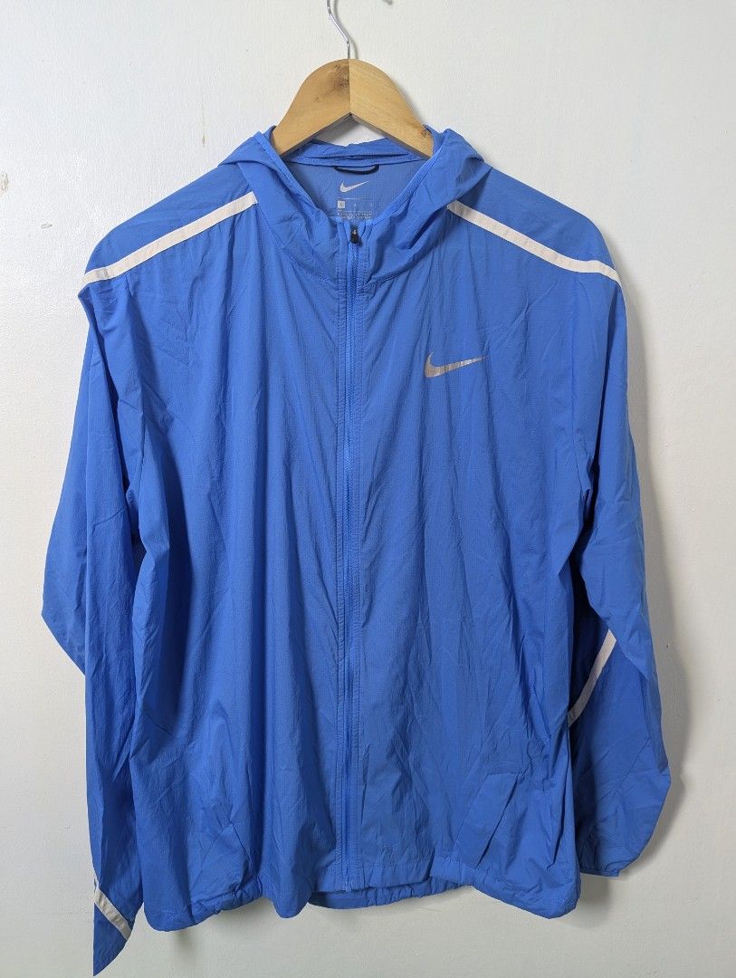 Nike Ultralight Windbreaker for Men - Large (Category: Coats, Jackets and Outerwear) located in Quezon City. Submitted by activefitforless (Listing ID 1459083428, Image 2). Description: All items are preloved / thrifted and may show normal signs of previous use. Any noticeable flaws will be disclosed whenever possible. Please check the actual item photos and measurements before purchasing. AI-generated model images are used for styling and fit re