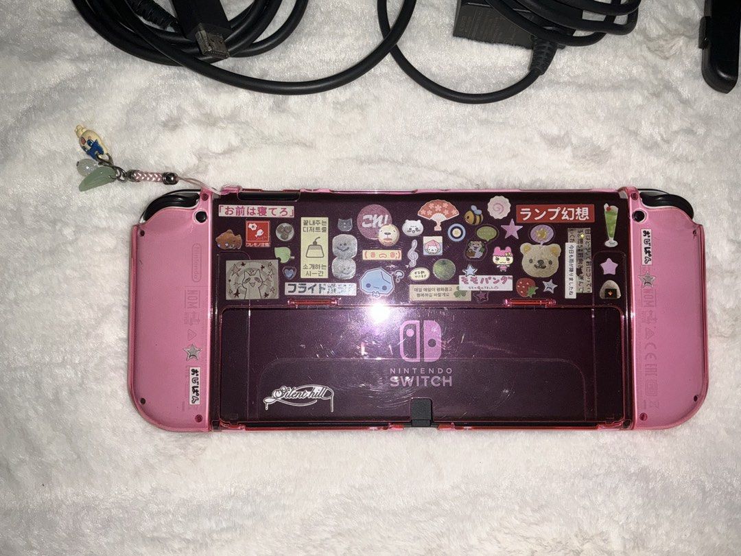 Nintendo Switch OLED (complete) (Category: Nintendo) located in Caloocan City. Submitted by sharjm (Listing ID 1459061764, Image 3). Description: selling my nintendo switch OLED!! Inclusions: Complete accessories pink clear case and thumb grips keychain Unit has no issues like scratches or dents at all. Performance and battery is 10/10, and no stick drifts:)) Rfs: planning to upgrade to ns2 delivery: lalamove/lbc/jnt meetups: around sm grand.