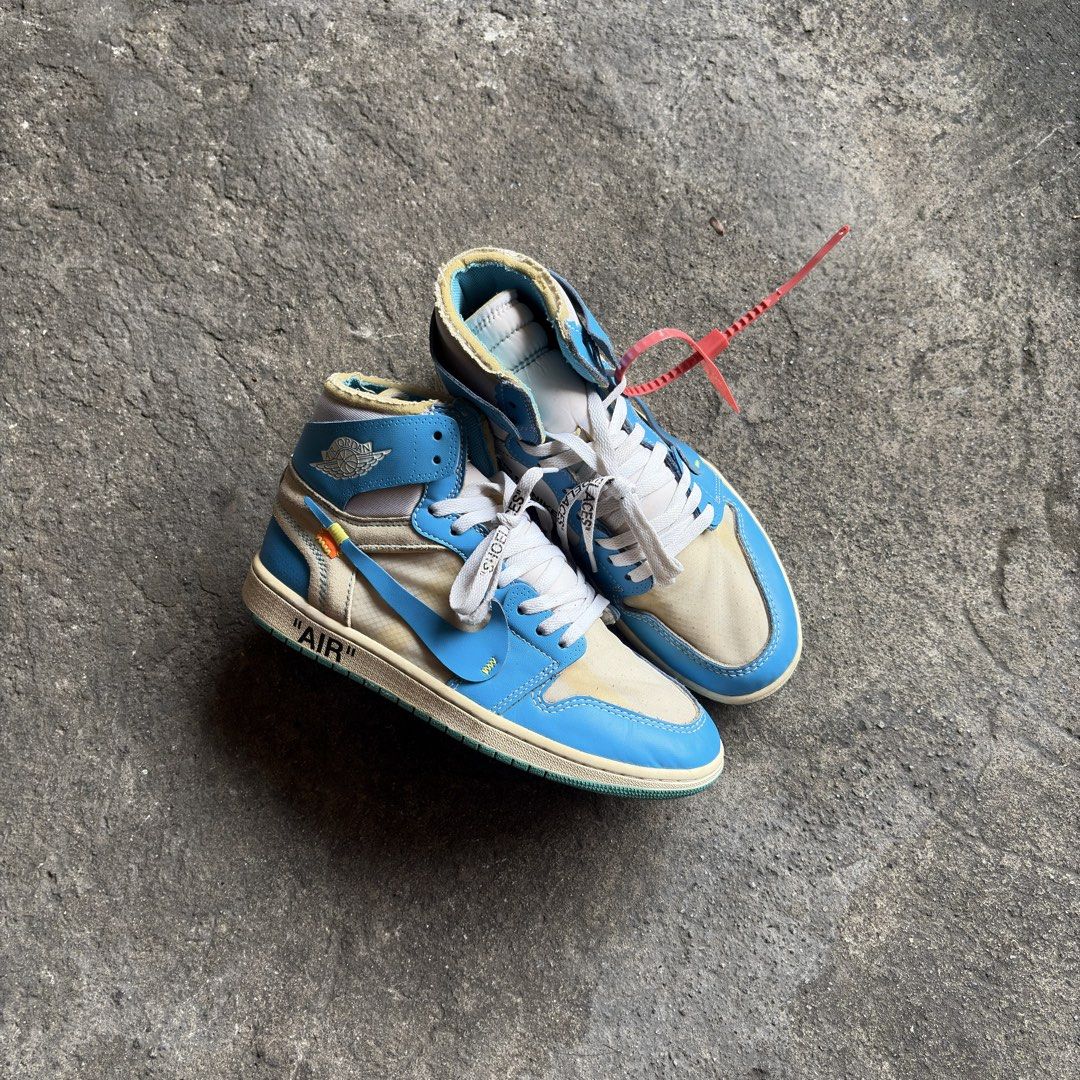 Off-White - Air Jordan 1 Retro High "UNC" (Category: Sneakers) located in Taguig. Submitted by _grailedph (Listing ID 1459080930, Image 3). Description: Off-White - Air Jordan 1 Retro High "UNC" Check photos for reference Size: 9mens/27cm Minor heeldrags No inclusions/Pair only Excellent Condition ₱ 2,000.