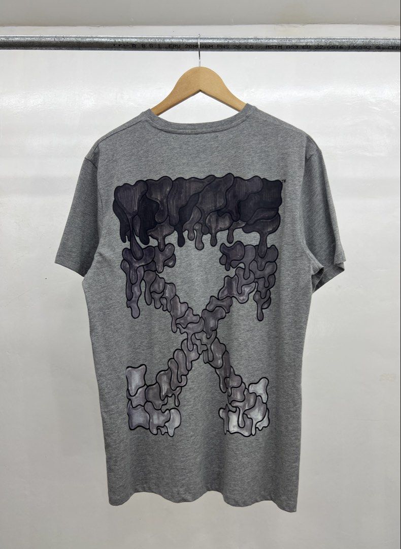 Off-White Grey Drip Arrow T-Shirt (Category: Tshirts & Polo Shirts ) located in Koronadal. Submitted by southloots. (Listing ID 1459051939, Image 2). Description: - Authentic Grey Off-White T-Shirt - Iconic drip arrow graphic on the back - Small Off-White logo on the front chest - Made with quality fabric for comfort - Ideal for everyday casual wear - Authenticity guaranteed: Check tags & scan QR code for verification.