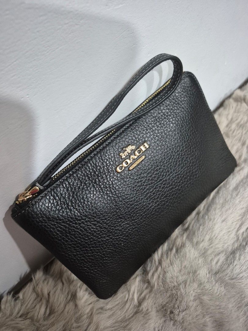 Original Coach Large Wristlet (Category: Wallets & Card holders) located in Cavite. Submitted by chaellebrandsluxe (Listing ID 1458935105, Image 2). Description: selling very low Large No inclusion LP posted already.