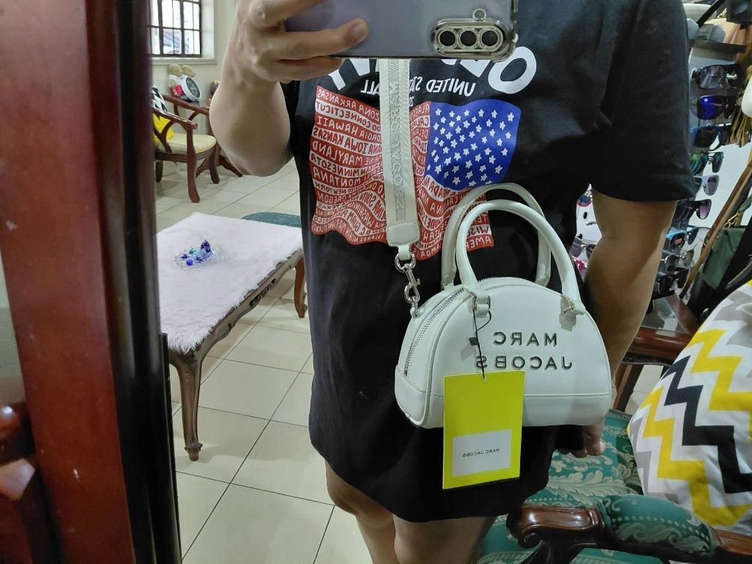 Original Marc Jacobs Silver Mini Duffle Bag (Category: Luxury Bags & Wallets) located in Pasig City. Submitted by janalopez904 (Listing ID 1456764852, Image 2). Description: - Authentic Marc Jacobs Mini Duffle Bag - Color: Silver - Original Price: PHP 10,000 - Selling Price: PHP 3,500 - Includes original dust bag and tags - Condition: Great, well-maintained - Perfect for a stylish new owner!.