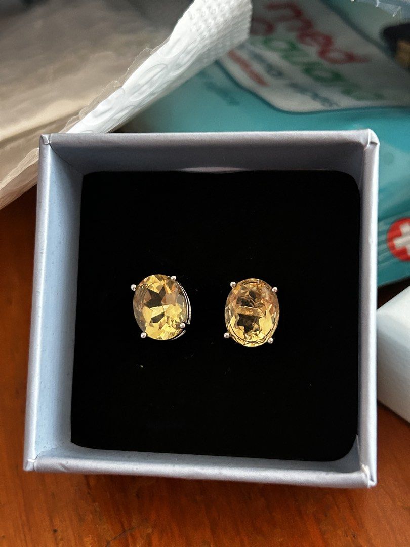 Oval Citrine Stud Earrings in Silver Setting (Category: Earrings) located in Cebu City. Submitted by yenetcuba52435 (Listing ID 1458903537, Image 1). Description: - Beautiful oval-cut citrine stud earrings - Set in silver-toned metal - Lovely warm yellow color - Comes in a small presentation box - Great for adding a pop of color to any outfit.