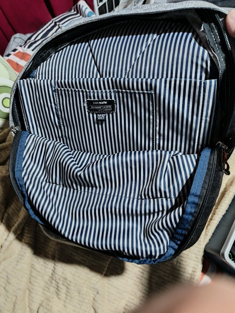 Pacsafe Slingsafe LX400 2 in 1 Backpack (Category: Backpacks) located in Quezon City. Submitted by bagsareus428 (Listing ID 1458950793, Image 3). Description: - Grey Pacsafe backpack 2 in 1 bags ( with detachable body bag /pouch. lightweight anti theft bagsp - Front zip pocket - Main compartment with laptop sleeve and internal pockets - Durable polyester material - Ideal for travel and everyday use - Zippers are in good working condition - Shows 