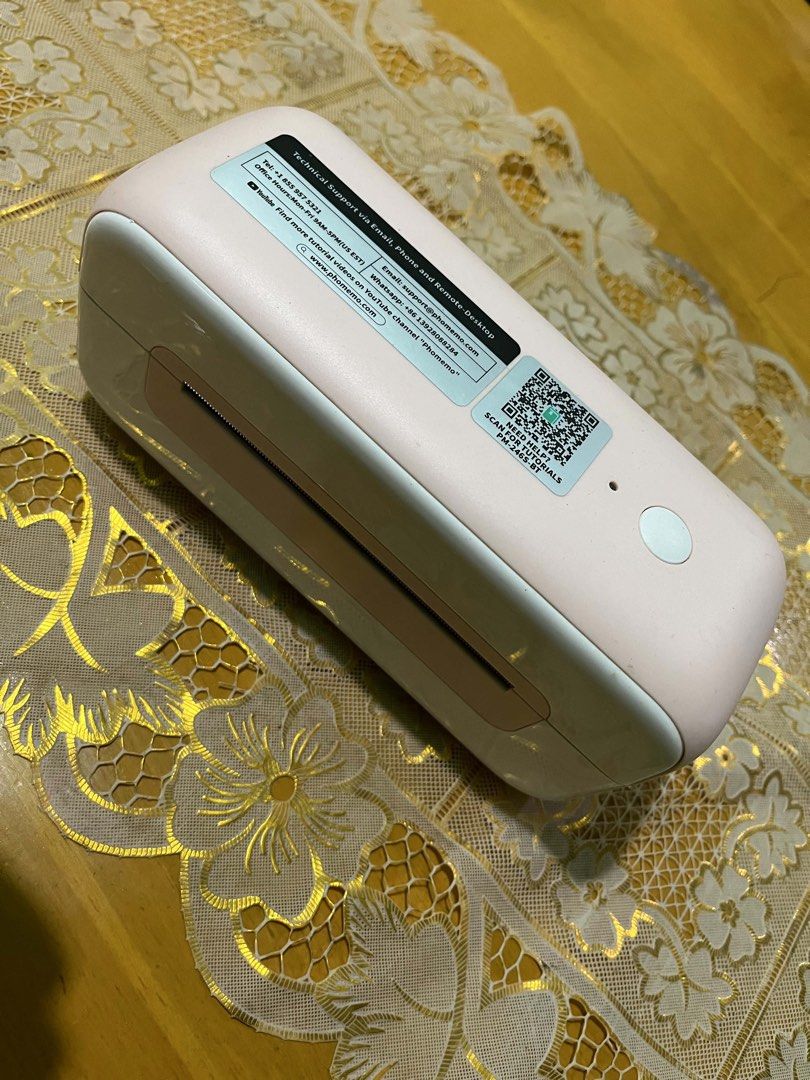 Phomemo Pink Thermal Label Printer Shipping Label Printer (Category: Printers, Scanners & Copiers) located in Carmona. Submitted by mikaela0515 (Listing ID 1458958463, Image 1). Description: - Phomemo Thermal Label Printer - Color: Pink and White - Ideal for small businesses - Prints 4x6 shipping labels - Supports various commercial direct desktop labels - Compatible with both label rolls and fan-fold labels - Get yours today!.