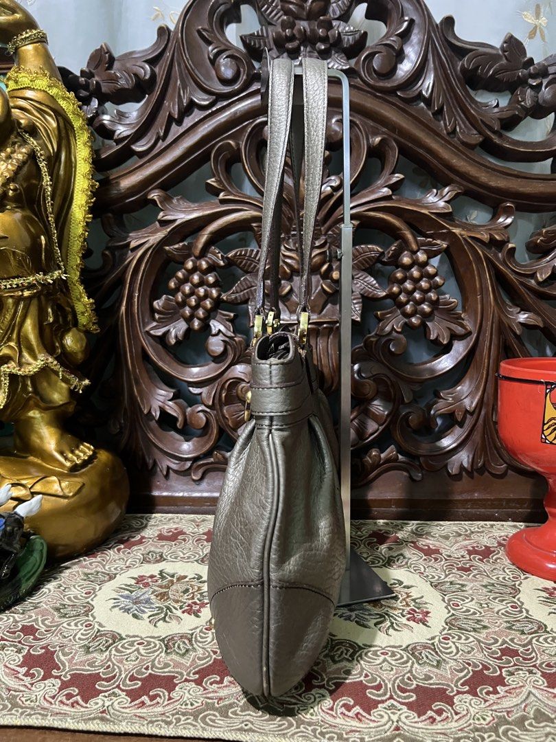 Pierre Cardin Metallic Textured Shoulder Bag (Category: Shoulder Bags) located in Manila. Submitted by deltaechoshop (Listing ID 1458906208, Image 3). Description: - Stylish metallic textured shoulder bag - Luxurious soft leather feel - Secure buckle closure on front flap - Comfortable top handles for easy carrying - Elegant gold-tone hardware details - Ample interior space for all your essentials - Ideal for everyday use.