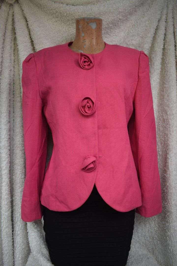 Pink Textured Blazer with Rose Button Details (Category: Coats, Jackets and Outerwear) located in Caloocan City. Submitted by cutielaichwan (Listing ID 1458952774, Image 3). Description: - Vibrant bright pink blazer - Textured fabric for added detail - Unique rose-shaped button closure (3 buttons) - Stylish puffed shoulders and long sleeves - Note: Faint marks present on the shoulder area - Perfect for adding a bold pop of color to any outfit.