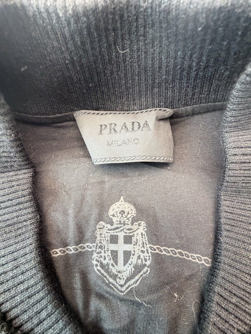 PRADA Fleece Teddy Bomber Jacket (Size M) – Black Enamel Triangle Logo (Category: Luxury Apparel) located in San Juan City. Submitted by vc828 (Listing ID 1458905580, Image 3). Description: PRADA Re-Nylon Fleece Teddy Bomber Jacket (Size M) – Black Enamel Triangle Logo Prada heavyweight sherpa fleece zip bomber jacket in black. Features the iconic Saffiano leather and metal enamel triangle logo on the chest, a large knitted Prada Milano crest mot