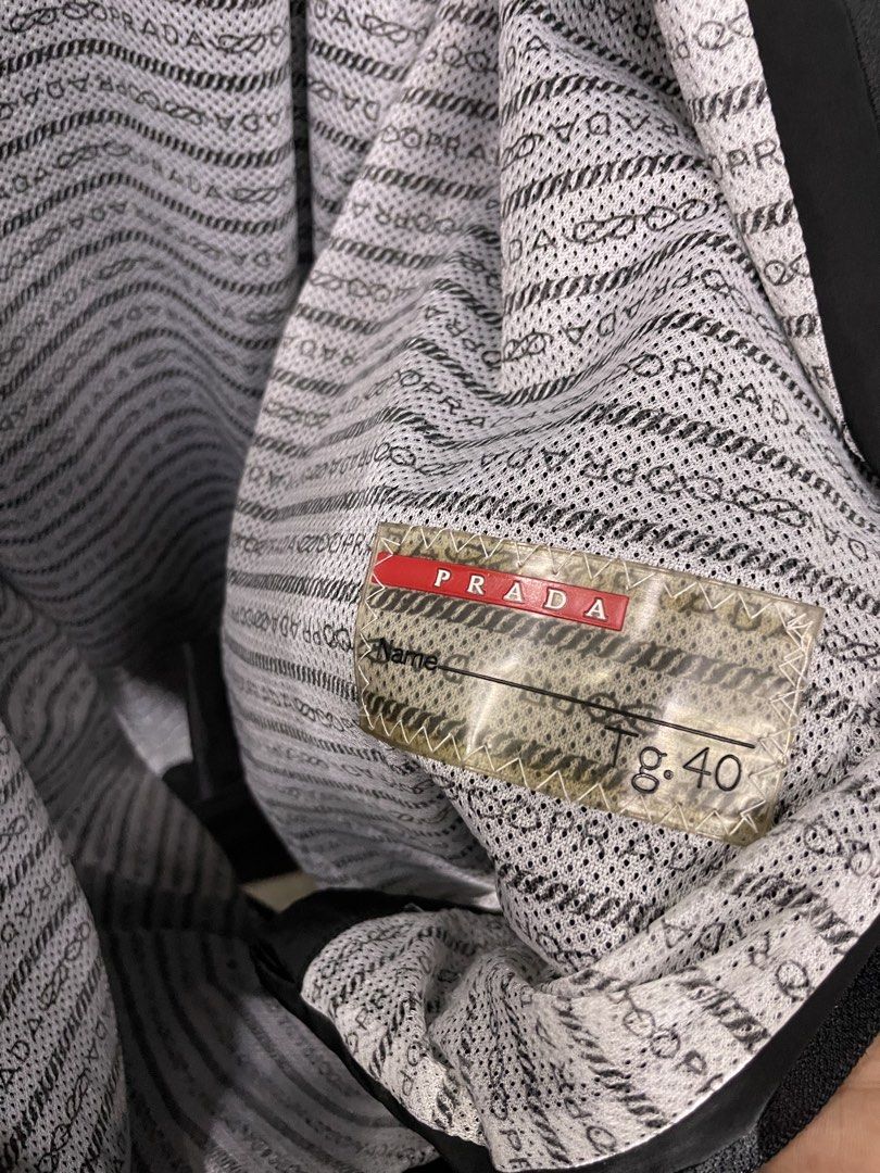 PRADA NYLON JACKET (Category: Coats, Jackets and Outerwear) located in Manila. Submitted by deyl_itzwhtt (Listing ID 1459006165, Image 3). Description: MEDIUM ON TAG FITTINGS LARGE TO XL WIDTH:23 LENGTH:28.5 - 29 ISSUE SMALL PINHOLE NO OTHER HIDDEN ISSUE✅.
