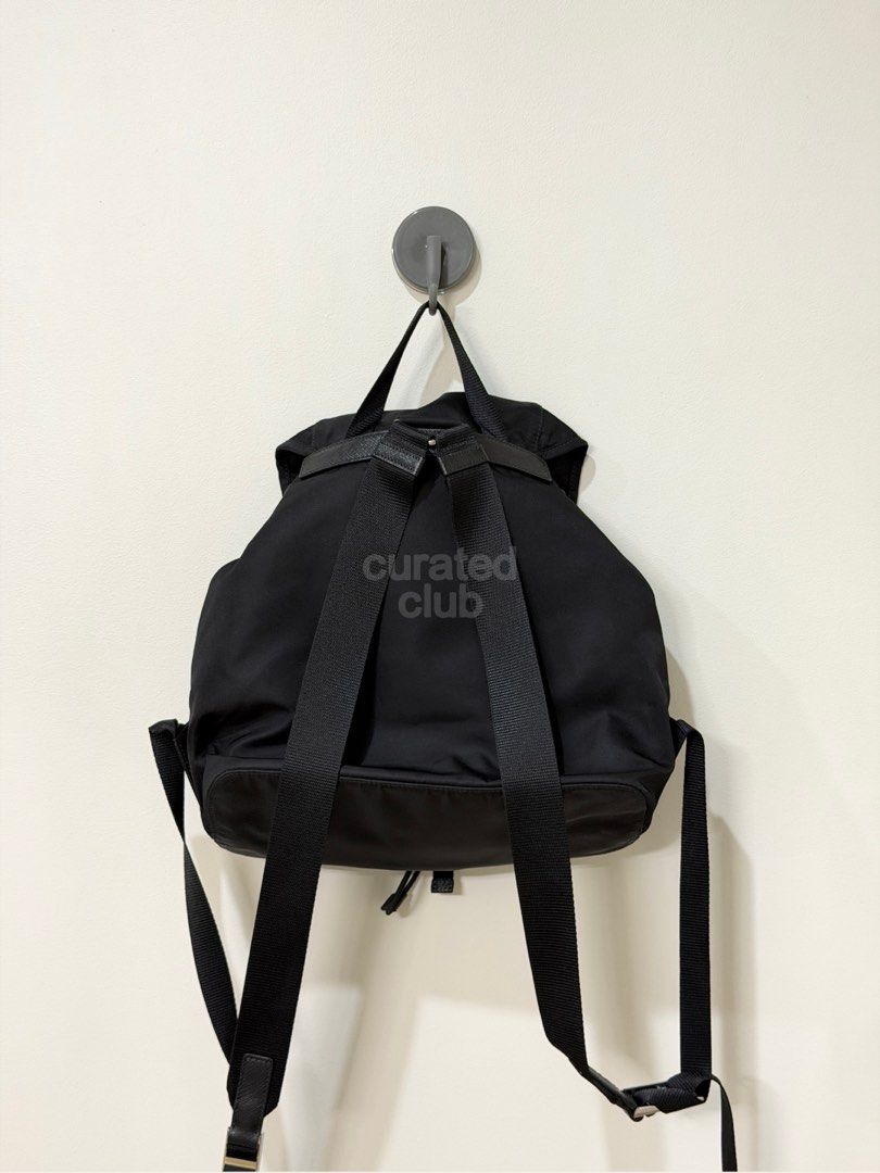 Preloved ★ PRADA Re-Nylon Black Drawstring Backpack (Category: Luxury Bags & Wallets) located in San Juan City. Submitted by curated.club (Listing ID 1459038944, Image 2). Description: ★ authenticated by LegitGrails—authenticity certificate included ★ please read bio and last slide of this listing before ordering ★ actual item color may differ slightly due to lighting and screen settings ★ bag only—no original inclusions; generic drawstring bag w