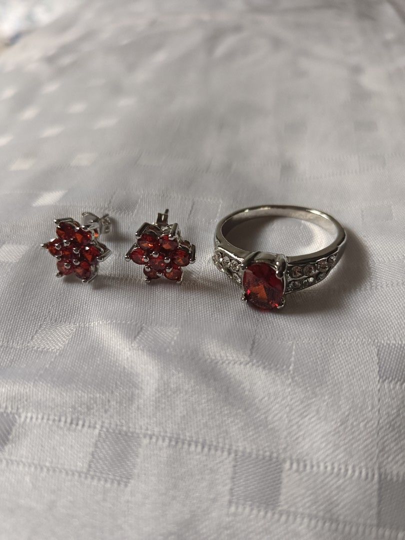 Red Gemstone Flower Earrings and Ring Set (Category: Earrings) located in Manila. Submitted by clover_co. (Listing ID 1458920346, Image 2). Description: - Cute matching set - Red flower-shaped earrings - Ring with large red gemstone - Ring band features smaller clear stones - Silver-toned metal - Perfect for adding a pop of color - Ideal for gifting or personal treat.