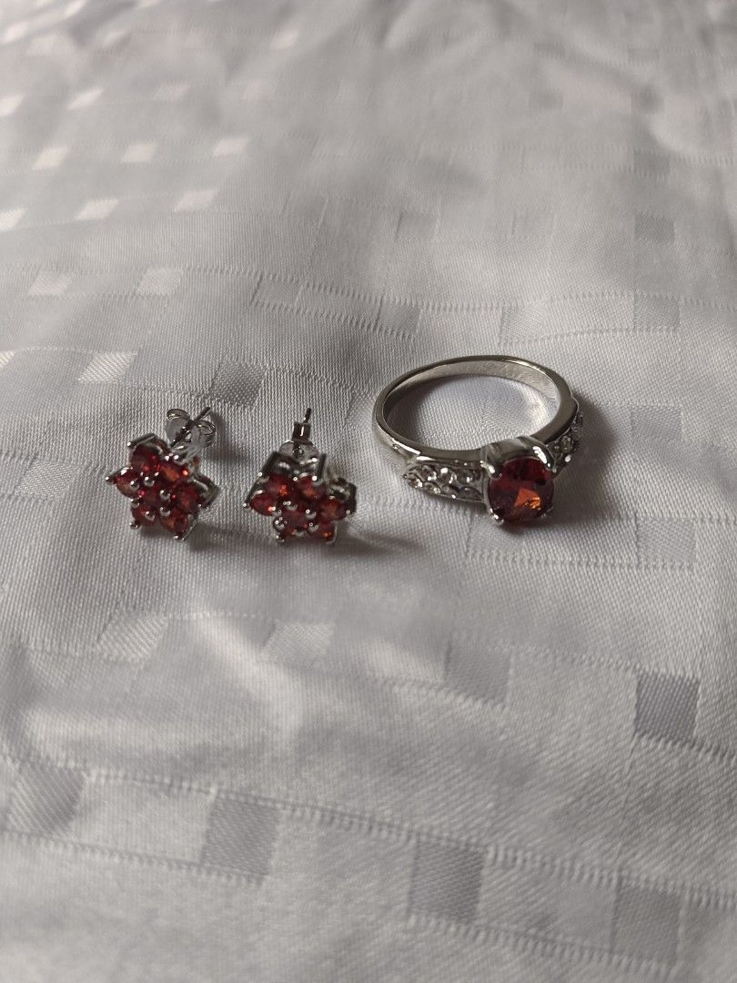 Red Gemstone Flower Earrings and Ring Set (Category: Earrings) located in Manila. Submitted by clover_co. (Listing ID 1458920346, Image 1). Description: - Cute matching set - Red flower-shaped earrings - Ring with large red gemstone - Ring band features smaller clear stones - Silver-toned metal - Perfect for adding a pop of color - Ideal for gifting or personal treat.