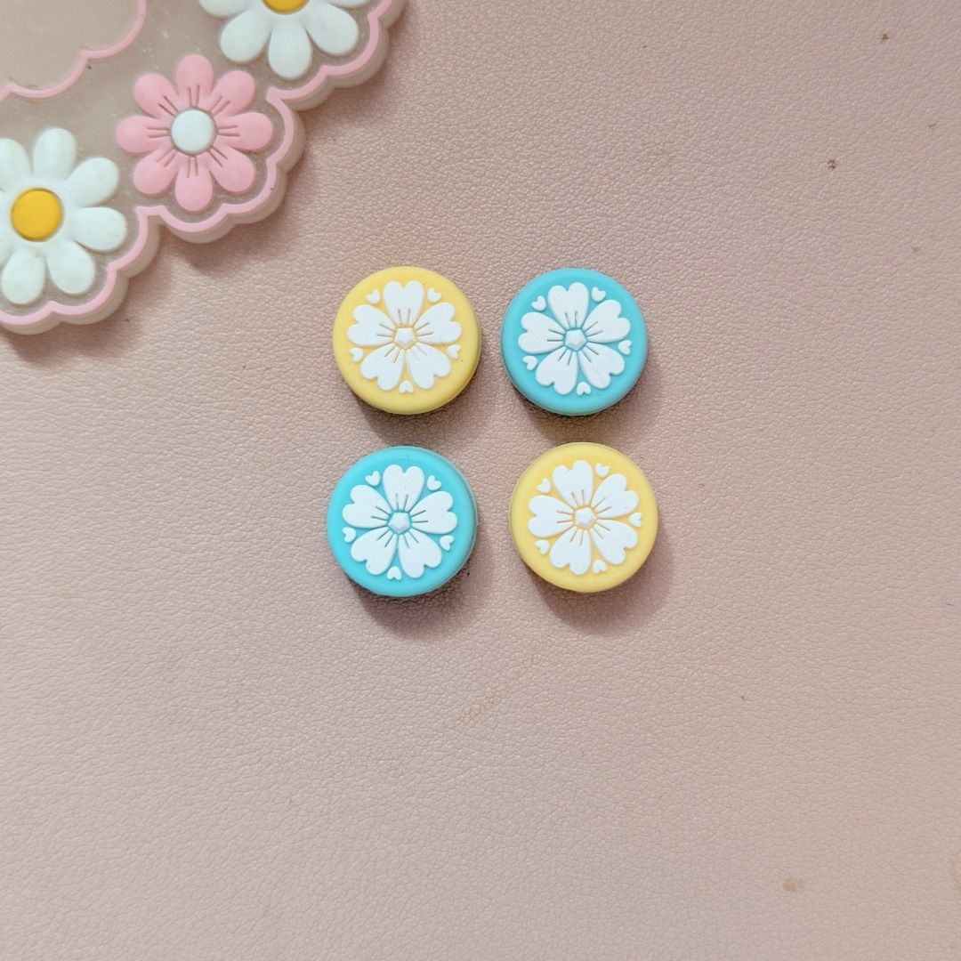 Sakura Thumb Grips for Nintendo Switch / Switch Lite - 4pcs (Category: Nintendo) located in Mandaluyong City. Submitted by bbkc.ph (Listing ID 1458901389, Image 2). Description: 🌸 Designed for Nintendo Switch & Switch Lite 🌸 Has a tight fit on joystick 🌸 Protects your original analog joysticks from dirt and wear and tear 🌸 May fit 3rd party controllers with small analog joysticks 🌸 Quantity: 4pcs 🌸 Material: Silicone 🌸 Pictures posted are 