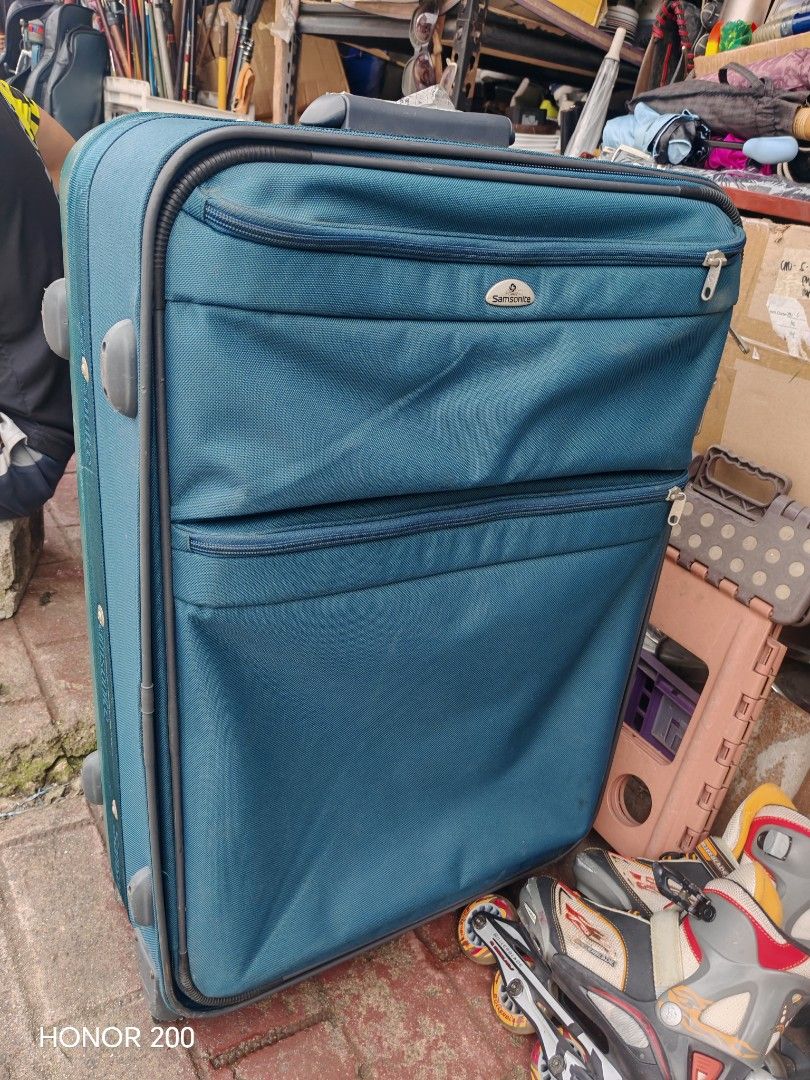 Samsonite Teal Expandable Suitcase Luggage (Category: Luggage) located in Manila. Submitted by mariceloch01539 (Listing ID 1458895516, Image 1). Description: - Samsonite teal suitcase - Expandable design for extra packing space - Two front zippered pockets - Interior straps to secure belongings - Wheels for easy transport - Approximate dimensions: 24 inches (height) x 16 inches (width).