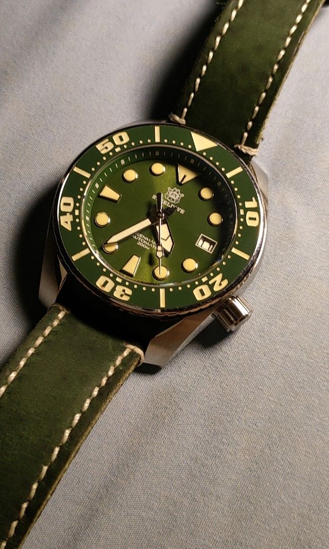 San Martin Diver Watch Green Dial Automatic (Category: Men's Watches) located in Quezon City. Submitted by nobody241625 (Listing ID 1449658580, Image 1). Description: - San Martin automatic diver watch - Striking green sunburst dial - Applied indices and date window - Bright luminous hands and markers for visibility - Durable stainless steel case - Functional rotating bezel - Comfortable green leather strap - Ideal for everyday wear and diving ad