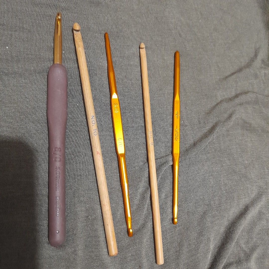 Set of Crochet Hooks - Various Sizes (Category: Craft Supplies & Tools) located in Bocaue. Submitted by marajapansurplus (Listing ID 1458948509, Image 1). Description: - Set of crochet hooks including aluminum and wooden options. - Various sizes available to suit different yarn weights. - Features one hook with a comfortable purple handle, marked 8/0 5.00mm. - Perfect for beginners and experienced crafters. - Great for all your yarn crafting proj