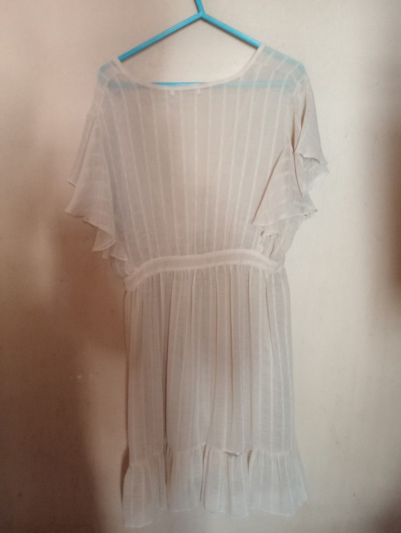 Sheer V-neck Ruffle Trim Dress (Category: Dresses) located in Makati City. Submitted by YSL80022 (Listing ID 1458944238, Image 2). Description: - Lightweight and sheer fabric used for beach cover up - Flattering V-neckline - Chic flutter sleeves - Comfortable elasticated waist - Stylish ruffle hem detail - Versatile for layering or beachwear - Very flowy, airy, and easy to wear RFS: closet clean up & weight gain .