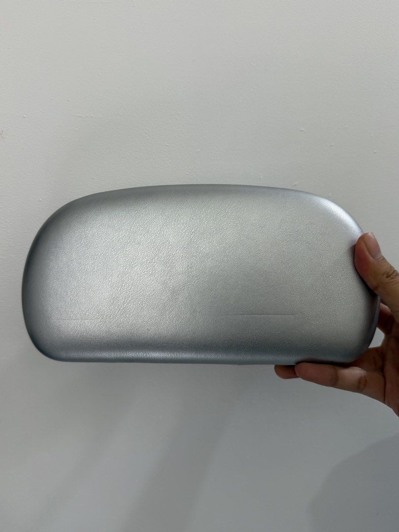 Silver Clutch Bag with Chrome Handle (Category: Clutches) located in Pasig City. Submitted by miss_abuelita (Listing ID 1458953789, Image 3). Description: - Chic silver clutch bag - Features a shiny chrome handle - Unique oval and smooth shape - Ideal for evening events and special occasions - Makes a bold statement - Crafted from faux leather material - Designed for comfortable carrying.
