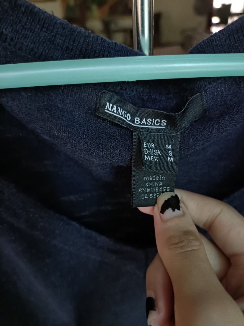 Size M MANGO navy blue sweater (Category: Longsleeves) located in Makati City. Submitted by supersellersara (Listing ID 1458928366, Image 3). Description: no stain, no damage. needs to be washed, been in storage for a while high stretch. garter still in good condition GCash paymemt. makati location Strictly no returns or refunds .