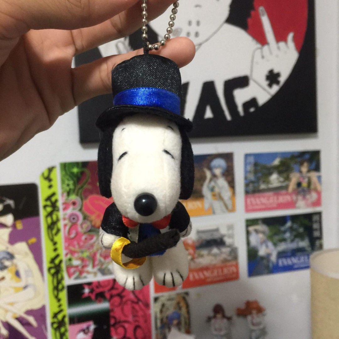 Snoopy Top Hat Plush Keychain with Sword (Category: Plushies & Soft Toys) located in Manila. Submitted by ikawbasiwagwag8 (Listing ID 1459079526, Image 1). Description: - Adorable Snoopy plush keychain - Dressed in a dapper top hat and tuxedo - Comes with a tiny sword and a ring - Ideal accessory for bags, backpacks, or keys - Also available: a charming purple hair doll.