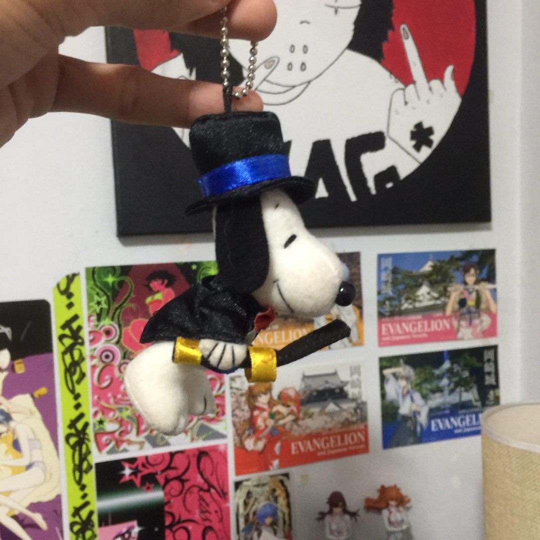Snoopy Top Hat Plush Keychain with Sword (Category: Plushies & Soft Toys) located in Manila. Submitted by ikawbasiwagwag8 (Listing ID 1459079526, Image 2). Description: - Adorable Snoopy plush keychain - Dressed in a dapper top hat and tuxedo - Comes with a tiny sword and a ring - Ideal accessory for bags, backpacks, or keys - Also available: a charming purple hair doll.
