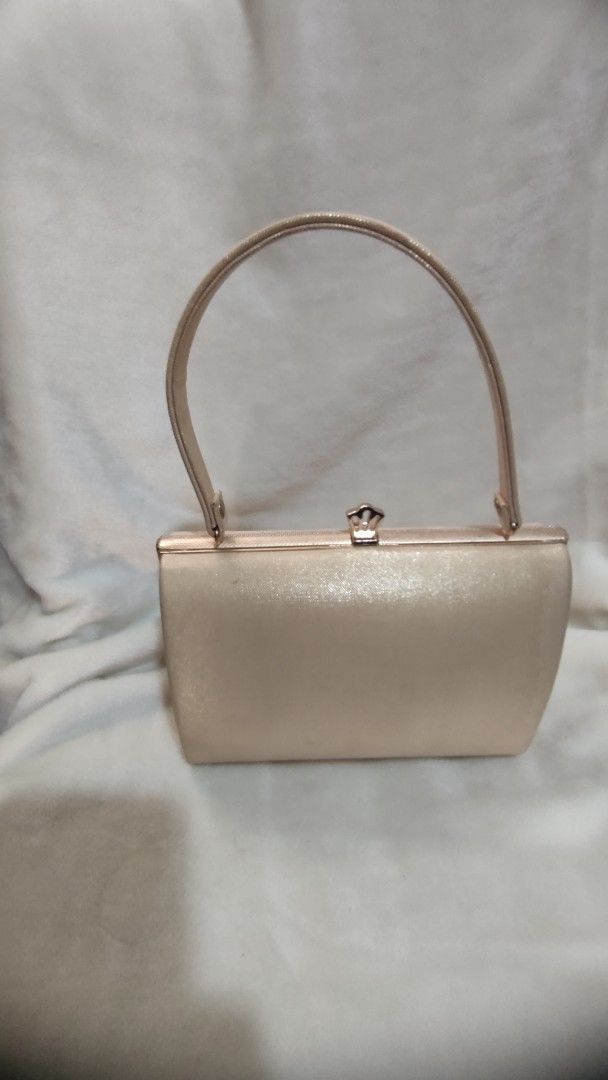 Sparkly Rose Gold Clutch Bag with Handle (Category: Clutches) located in Manila. Submitted by annetteasi22390 (Listing ID 1458950804, Image 3). Description: - Cute sparkly clutch bag - Rose gold color with textured pattern - Features a small handle - Interior card slots for convenience - Ideal for parties and special occasions - Approximately 8 inches wide.