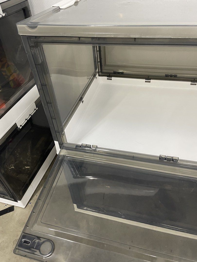 Stackable Clear Storage Boxes with Lids (Category: Storage Boxes & Baskets) located in Kuala Lumpur. Submitted by br815 (Listing ID 1458894238, Image 3). Description: Pick up at Taman Petaling Utama - Stackable storage boxes to maximize space. - Clear front panel for easy visibility of contents. - Convenient front door for quick access. - Ideal for organizing shoes, clothes, toys, and more. - Approximate dimensions: 18" (Height) x 14" (Width) x 1