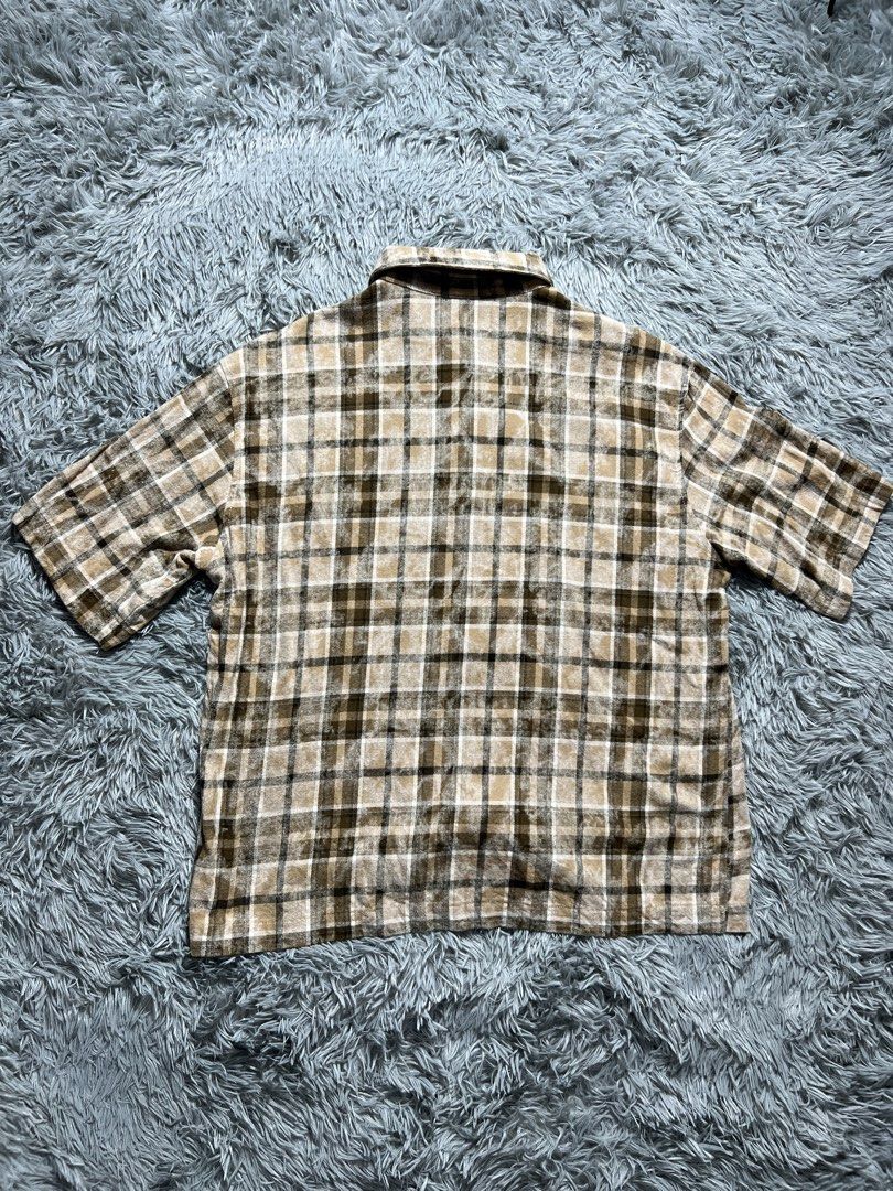 SUMWON Plaid Short Sleeve Button Up Shirt (Category: Tshirts & Polo Shirts ) located in Naga. Submitted by eighttttt (Listing ID 1458918946, Image 3). Description: - Brown and beige plaid short sleeve shirt - Features white Arabic script and 'SUMWON' graphic on the front - Button-up closure - Estimated size S (based on tag) - fit M to L - Ideal for casual wear.
