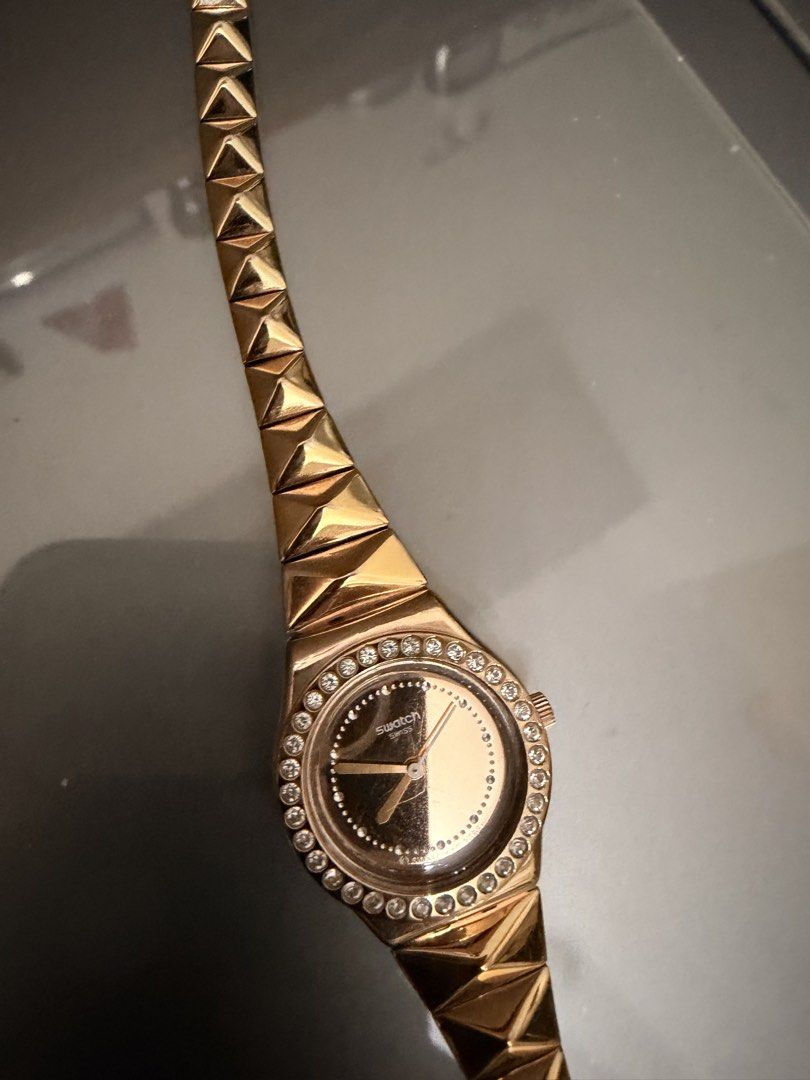 Swatch Rose Gold Watch with Crystal Bezel (Category: Women's Watches) located in Quezon City. Submitted by ellamenopi (Listing ID 1459080263, Image 2). Description: - Rose gold Swatch watch - Crystal-embellished bezel - Unique geometric band design - Water-resistant stainless steel - Swiss made - Ideal for dressing up or everyday wear.