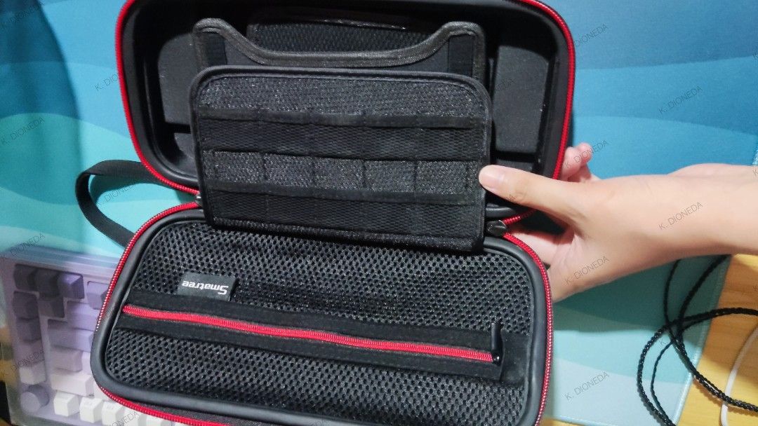 Switch v1 carry case (Category: Cases & Covers) located in Pasig City. Submitted by kiana_kaz12 (Listing ID 1458902083, Image 2). Description: SELLING Nintendo Switch v1 carry case Smatree 300 php Used like New - Rarely used Can fit charger Has tabletop built-in stand Location: PASIG MOP: COD via lalamove or GCash RFS: Nakatambak nalang. Cross posted.