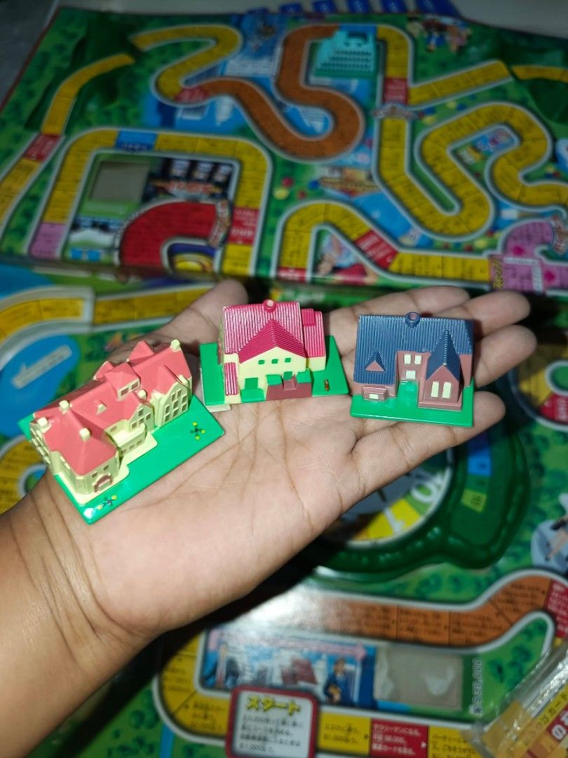 Takara Tomy Life Game Board Game (Category: Board Games & Puzzles) located in Caloocan City. Submitted by wjsixteen (Listing ID 1458907607, Image 3). Description: - Japanese version of the classic Life board game by Takara Tomy. - Complete set includes game board, spinner, money, houses, and player pieces. - Fun for the whole family. - Ideal for exciting game nights..